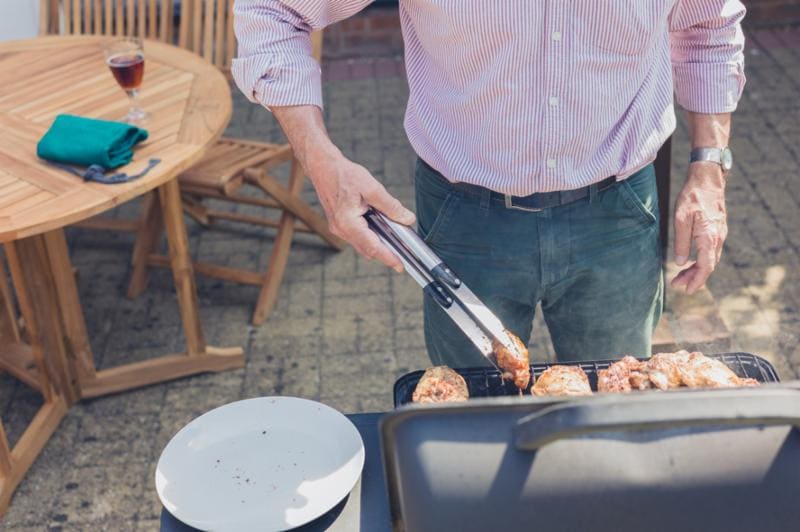 image of man grilling